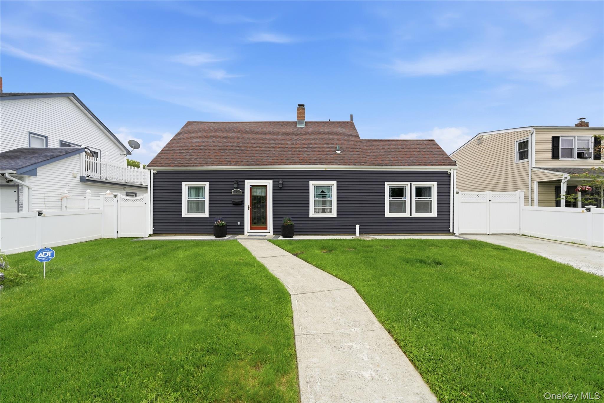 50 Ridge Lane Levittown, NY 11756 - Photo 1 of 27 a front view of a house with a yard