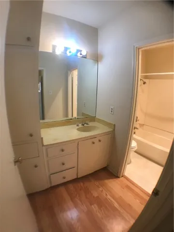 a bathroom with a sink a mirror and a shower