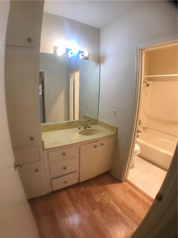 2529 Rio Grande Street, Unit 9 Austin, TX 78705 - Photo 12 of 18 a bathroom with a sink a mirror and a shower