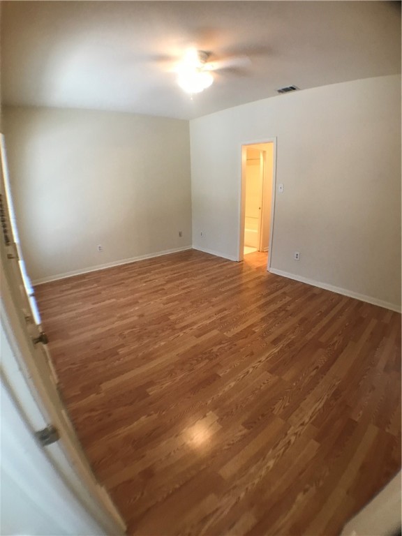 2529 Rio Grande Street, Unit 9 Austin, TX 78705 - Photo 13 of 18 an empty room with wooden floor and windows
