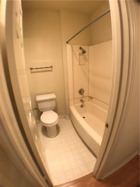 2529 Rio Grande Street, Unit 9 Austin, TX 78705 - Photo 15 of 18 a bathroom with a granite countertop sink a toilet and shower