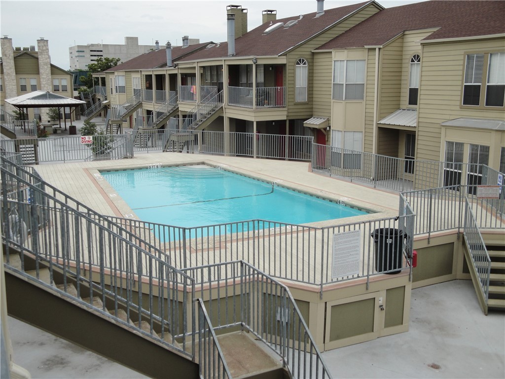 2529 Rio Grande Street, Unit 9 Austin, TX 78705 - Photo 2 of 18 a view of a white building with a balcony