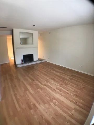 a view of empty room with fireplace