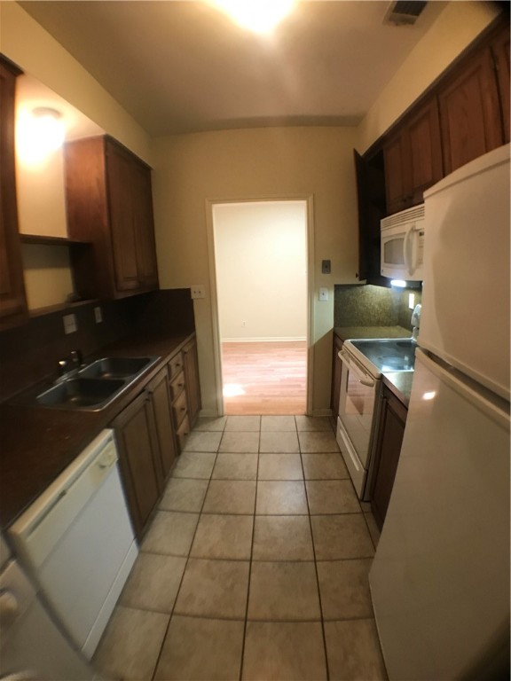 2529 Rio Grande Street, Unit 9 Austin, TX 78705 - Photo 9 of 18 a kitchen with a sink a counter top space and cabinets