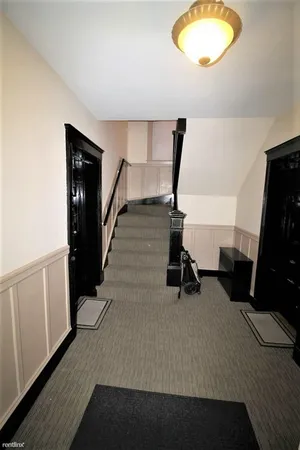 a view of entryway with wooden floor