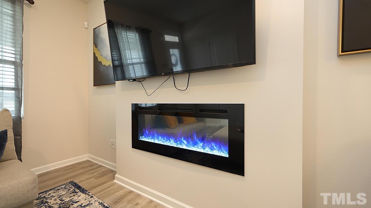 3705 Putman Road Raleigh, NC 27610 - Photo 3 of 19 a picture of a room with a fireplace and cabinets