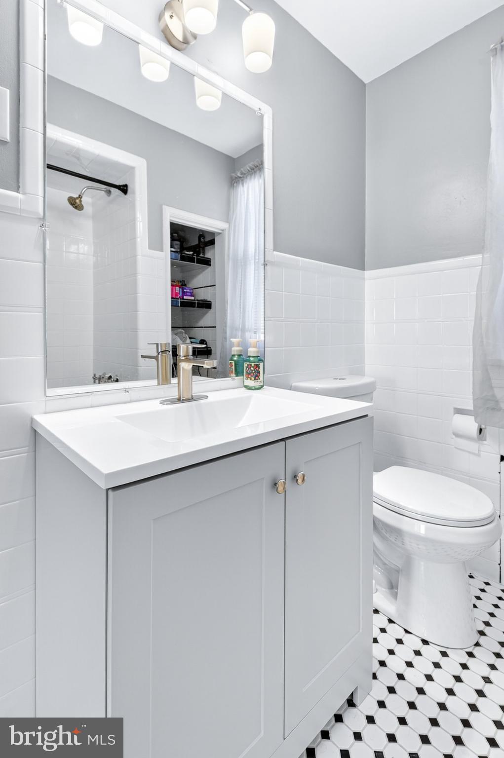 1025 Cornwall Road Lebanon, PA 17042 - Photo 20 of 36 a bathroom with a sink a toilet and mirror