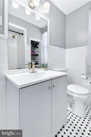 a bathroom with a sink a mirror and a bathtub