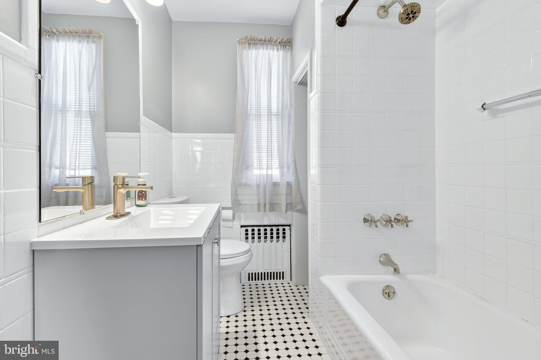 1025 Cornwall Road Lebanon, PA 17042 - Photo 22 of 36 a bathroom with a sink a mirror and a bathtub