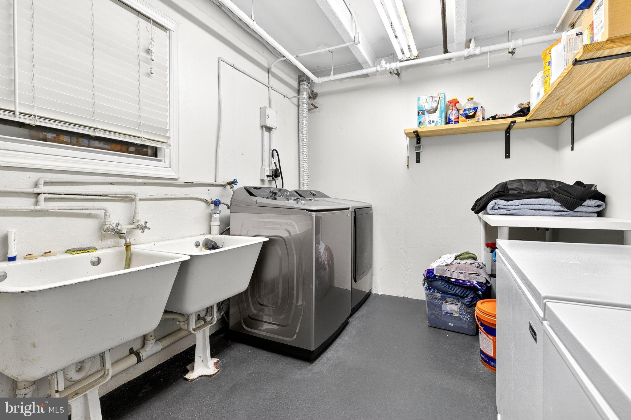 1025 Cornwall Road Lebanon, PA 17042 - Photo 24 of 36 a utility room with a sink a stove and cabinets