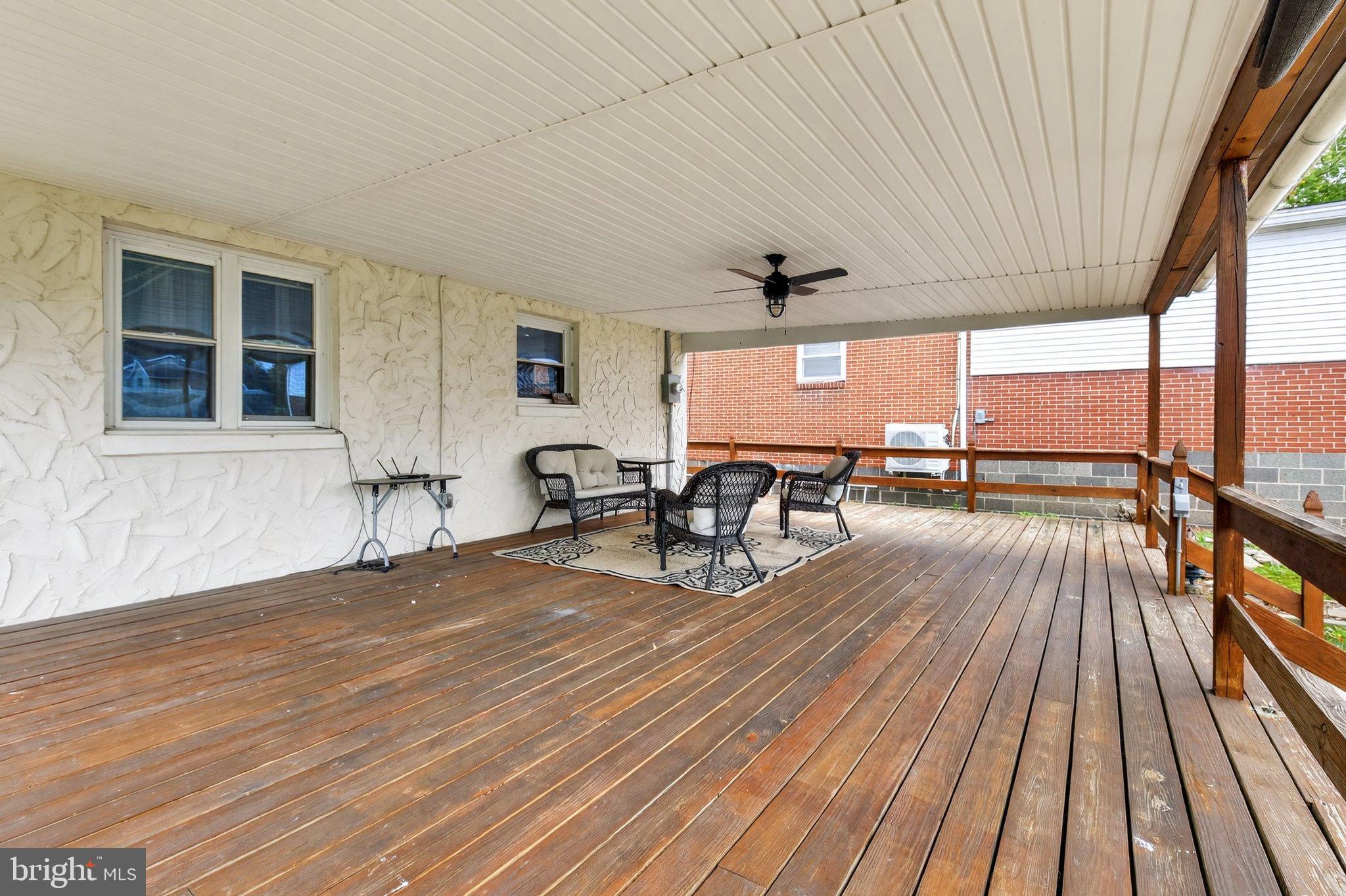 1025 Cornwall Road Lebanon, PA 17042 - Photo 28 of 36 a view of a patio with table and chairs with wooden floor