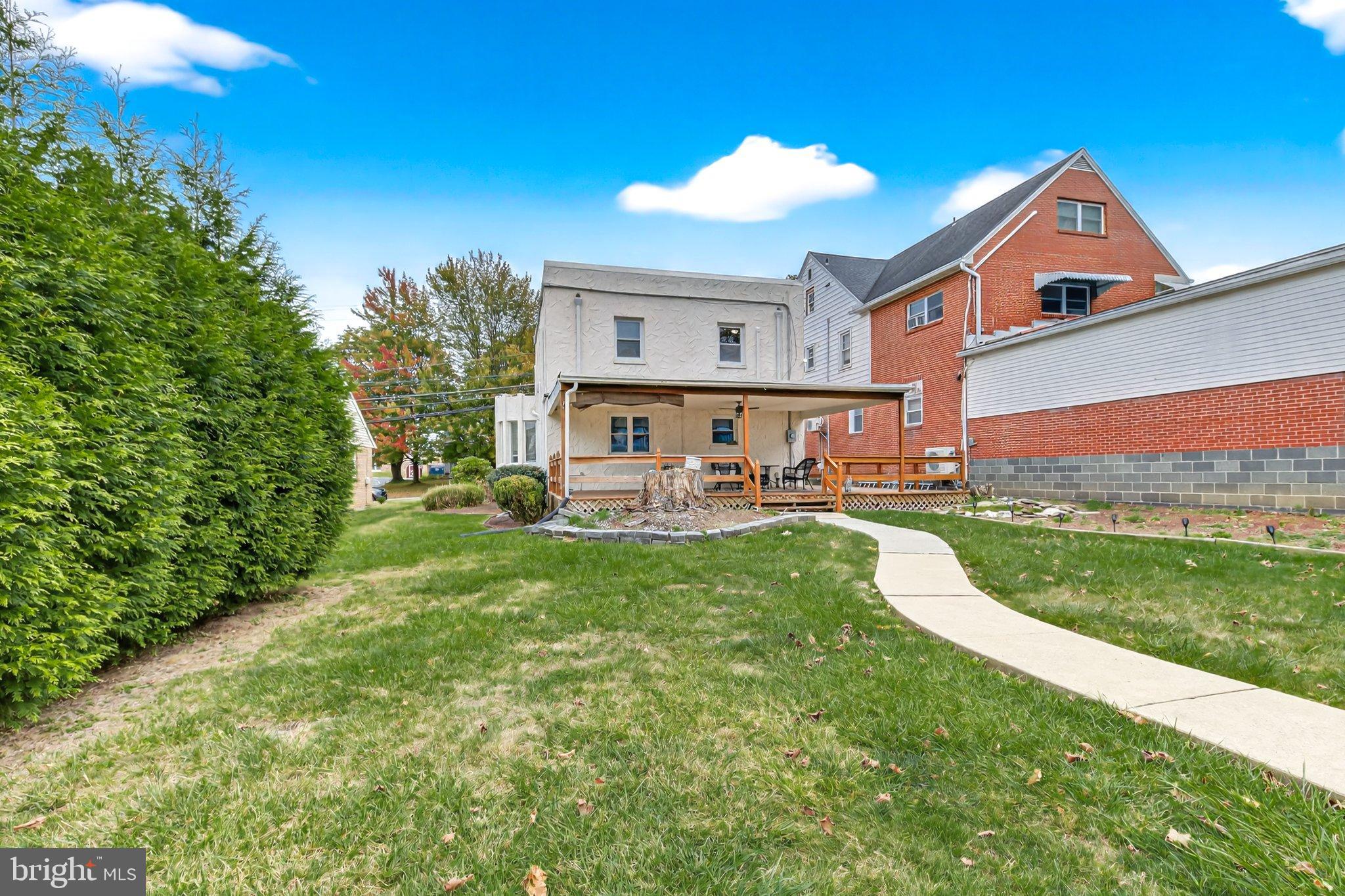 1025 Cornwall Road Lebanon, PA 17042 - Photo 33 of 36 a front view of a house with a yard table and chairs