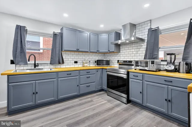 a kitchen with sink cabinets and window