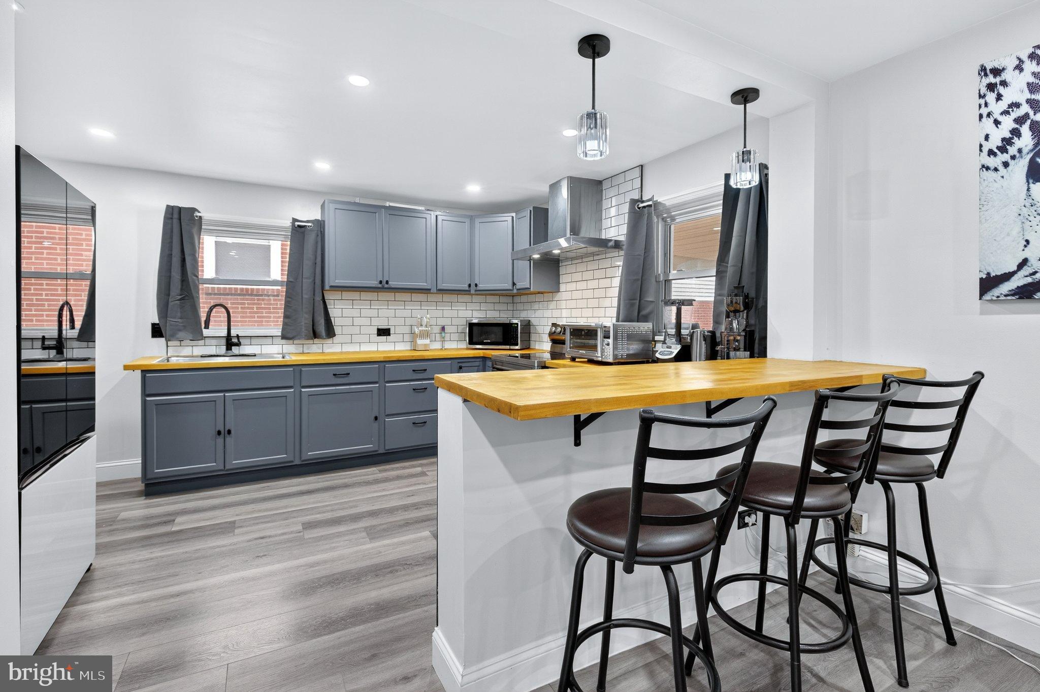 1025 Cornwall Road Lebanon, PA 17042 - Photo 5 of 36 a kitchen with a table chairs sink and cabinets