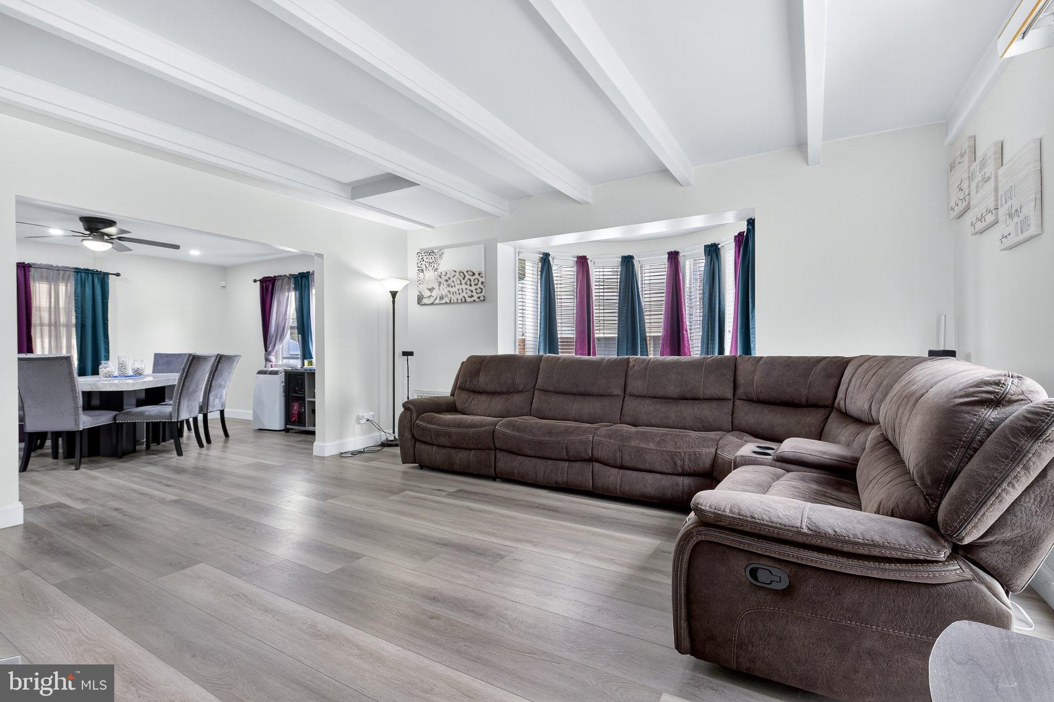 1025 Cornwall Road Lebanon, PA 17042 - Photo 7 of 36 a living room with furniture and a dining table with kitchen view