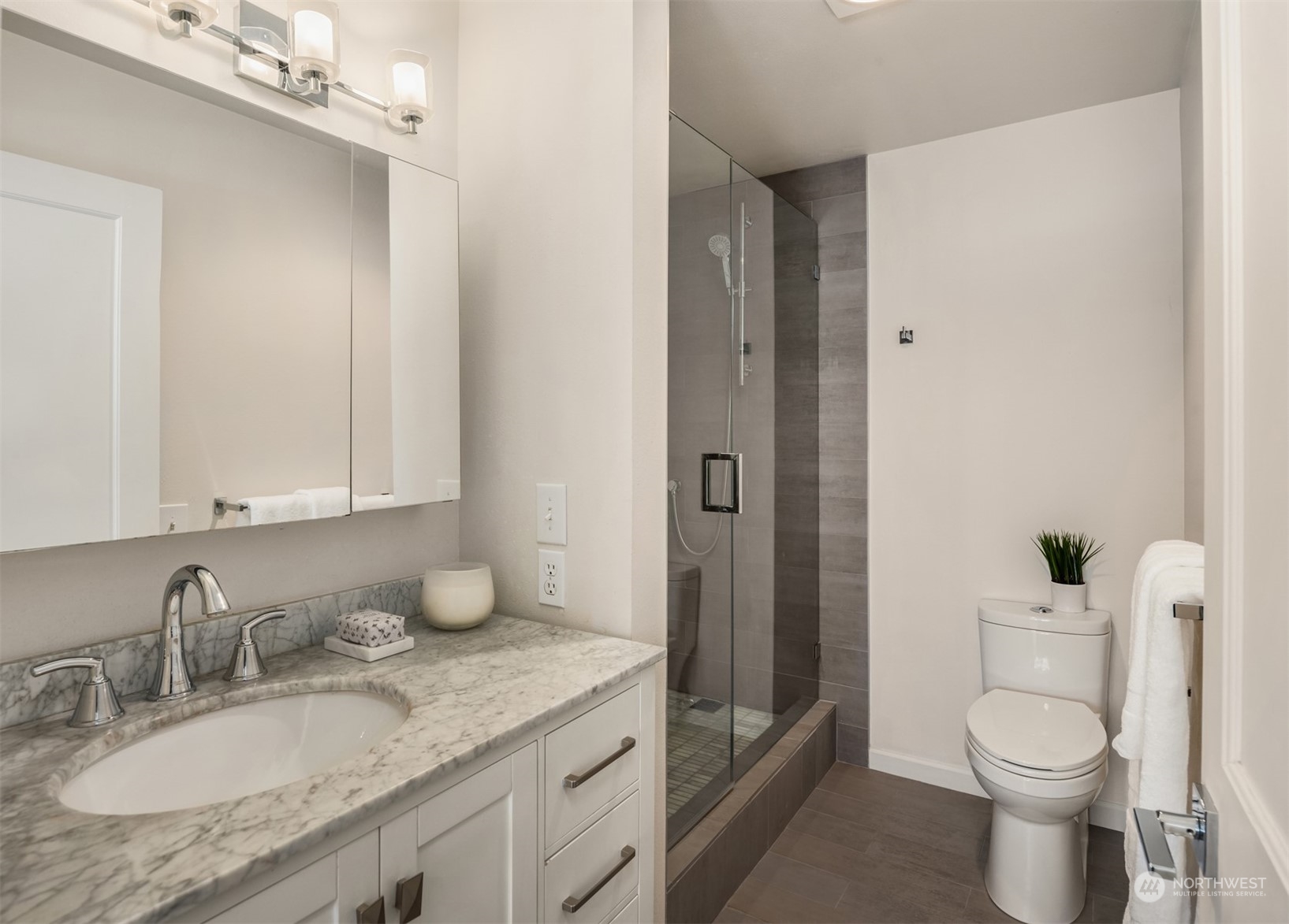 500 Aloha Street, Unit E111 Seattle, WA 98109 - Photo 18 of 25 a bathroom with a granite countertop sink toilet and shower
