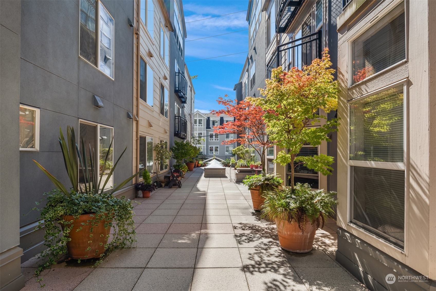 500 Aloha Street, Unit E111 Seattle, WA 98109 - Photo 19 of 25 a view of a pathway along the building