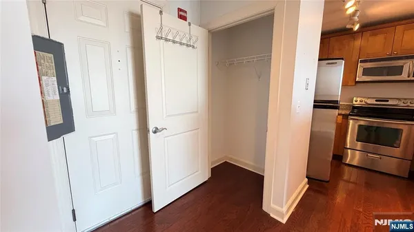 a kitchen with stainless steel appliances a refrigerator and a stove top oven