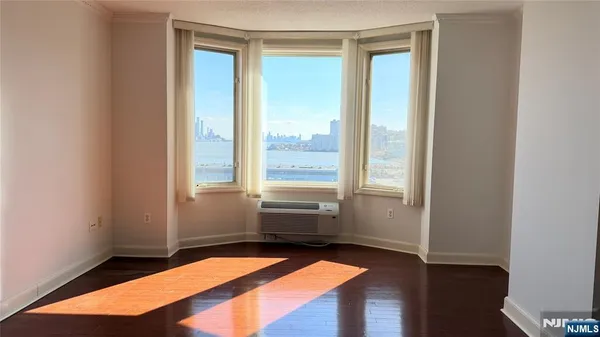 a room with window and a wooden floor
