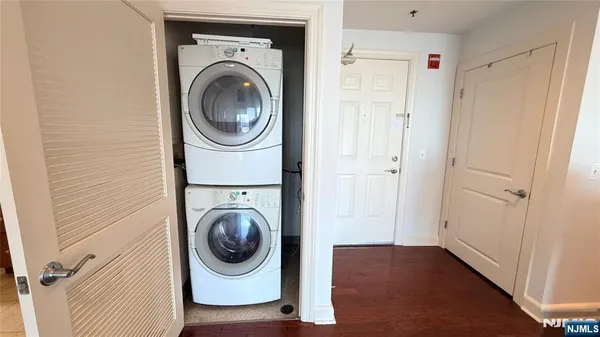 a utility room with sink dryer and washer