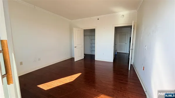 an empty room with wooden floor