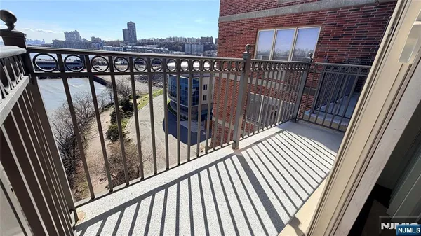 a view of a balcony with wooden floor