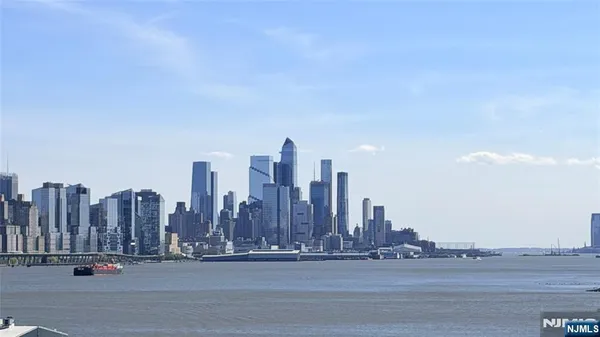a view of a city with a tall building