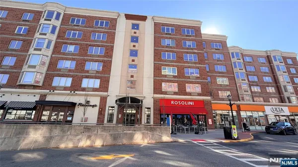 a front view of building with a yard