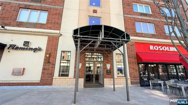 a view of a building with sitting area