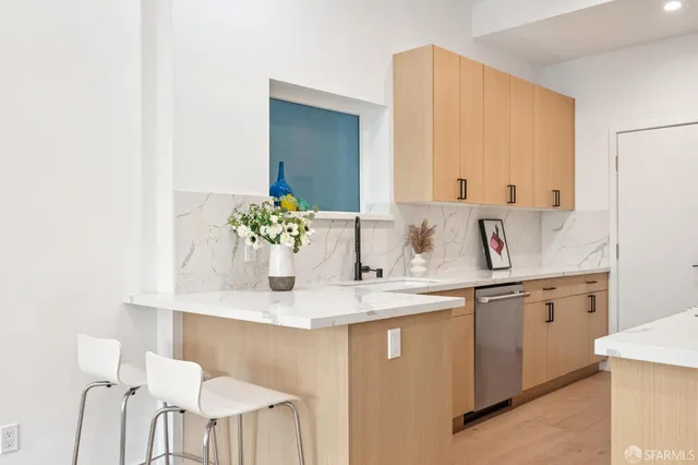 a kitchen with a sink and cabinets