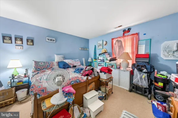 a bed room with a bed and a desk