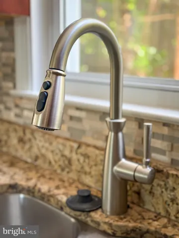 a view of a room with window and hardwood floor