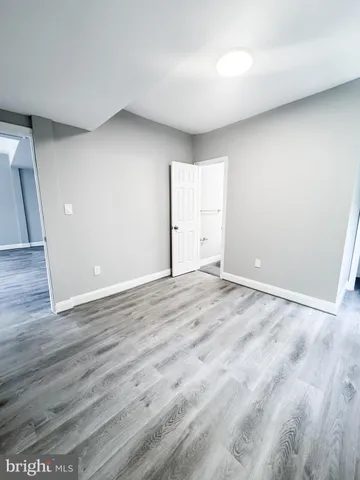 a bathroom with a sink mirror and toilet