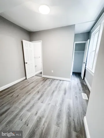 a bathroom with a sink toilet and mirror