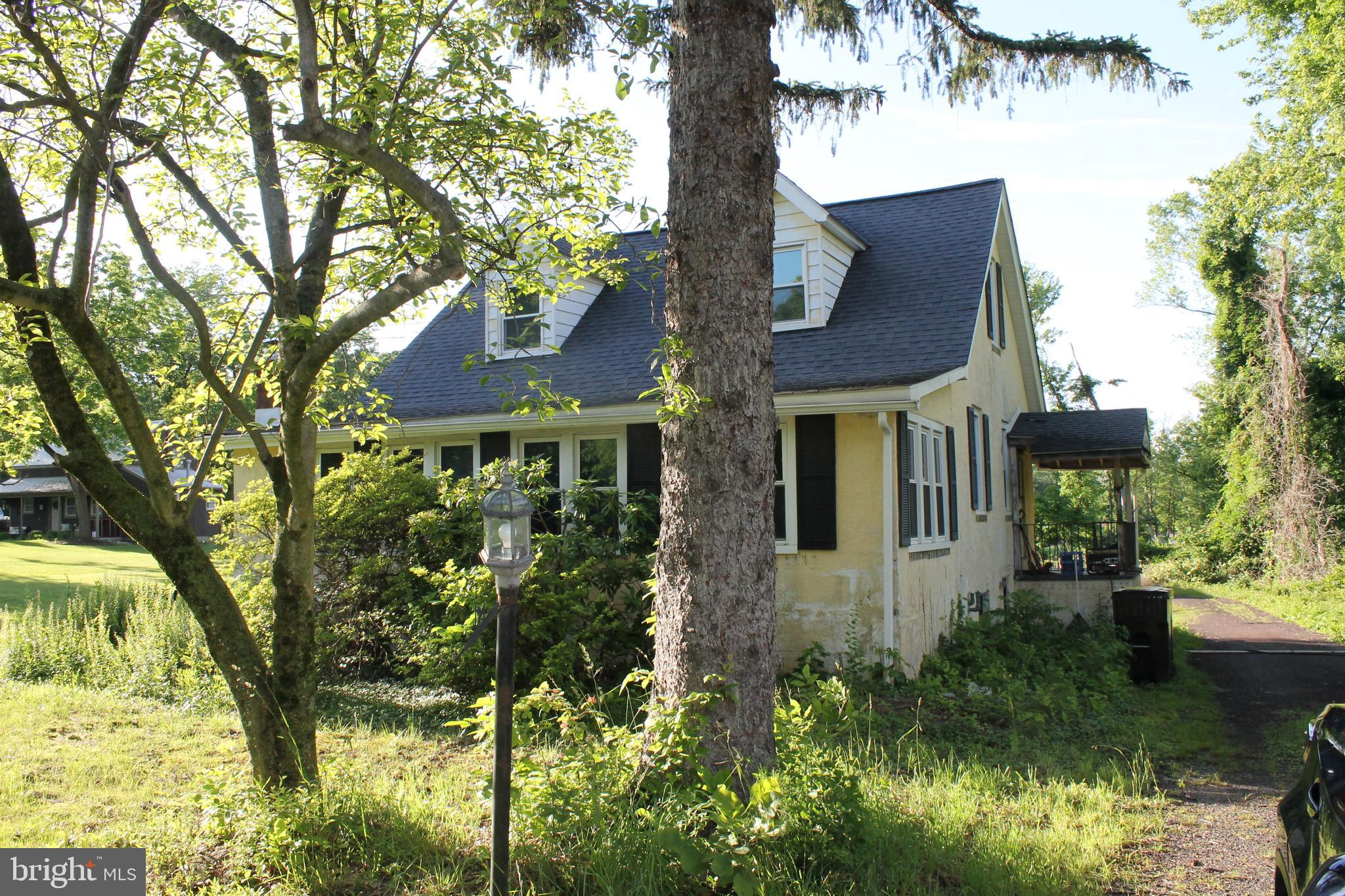 2042 Upper Ridge Road Green Lane, PA 18054 - Photo 1 of 5 a front view of a house with a yard