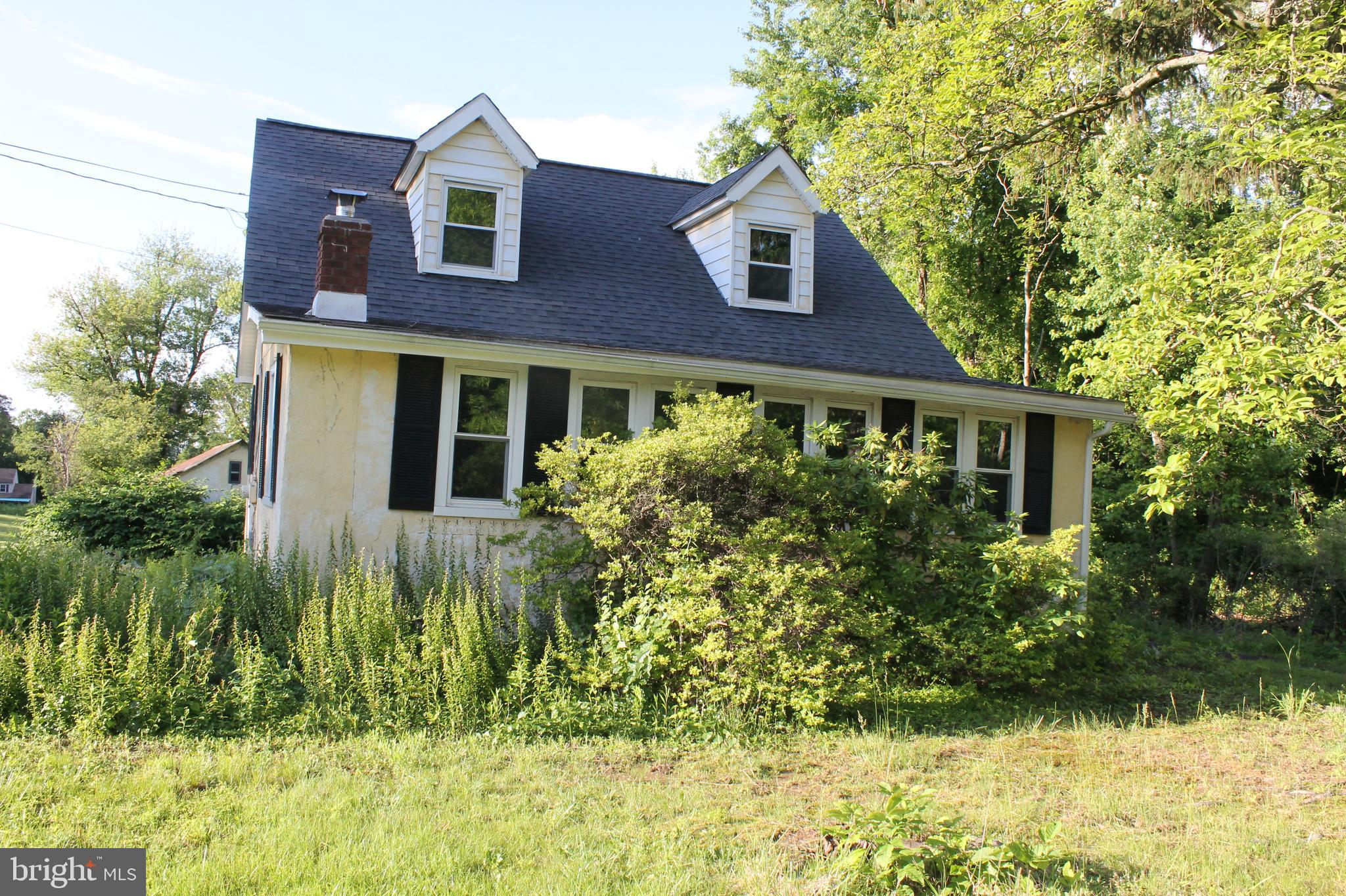 2042 Upper Ridge Road Green Lane, PA 18054 - Photo 3 of 5 a front view of a house with a yard
