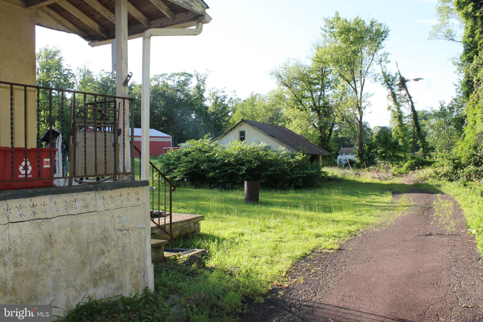 2042 Upper Ridge Road Green Lane, PA 18054 - Photo 4 of 5 a view of a chair and table in the patio with a lake view