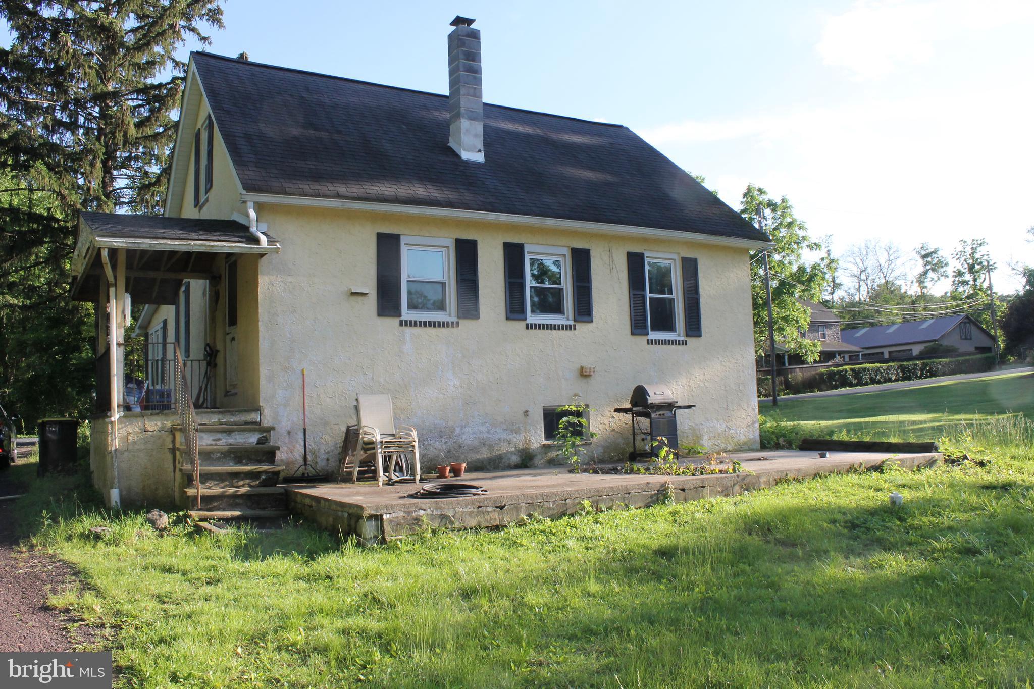 2042 Upper Ridge Road Green Lane, PA 18054 - Photo 5 of 5 a front view of a house with garden