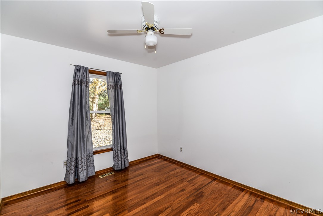 4217 Broad St Road Gum Spring, VA 23065 - Photo 14 of 39 an empty room with windows and ceiling fan