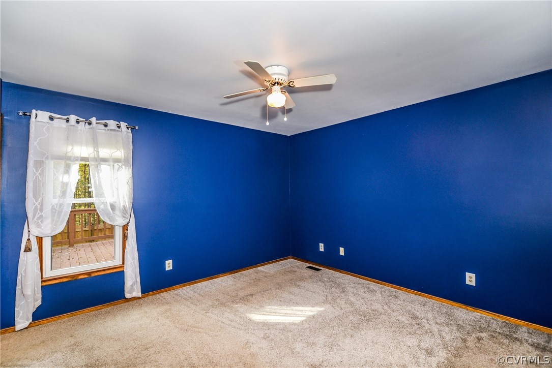 4217 Broad St Road Gum Spring, VA 23065 - Photo 16 of 39 an empty room with windows and fan