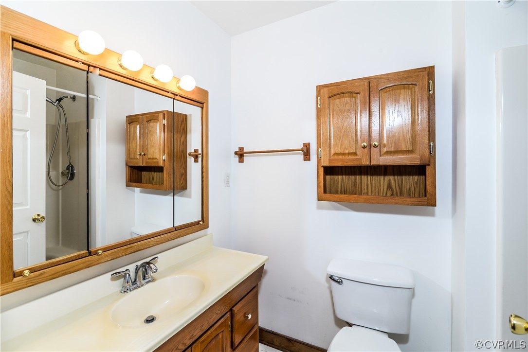 4217 Broad St Road Gum Spring, VA 23065 - Photo 22 of 39 a bathroom with a sink and a mirror