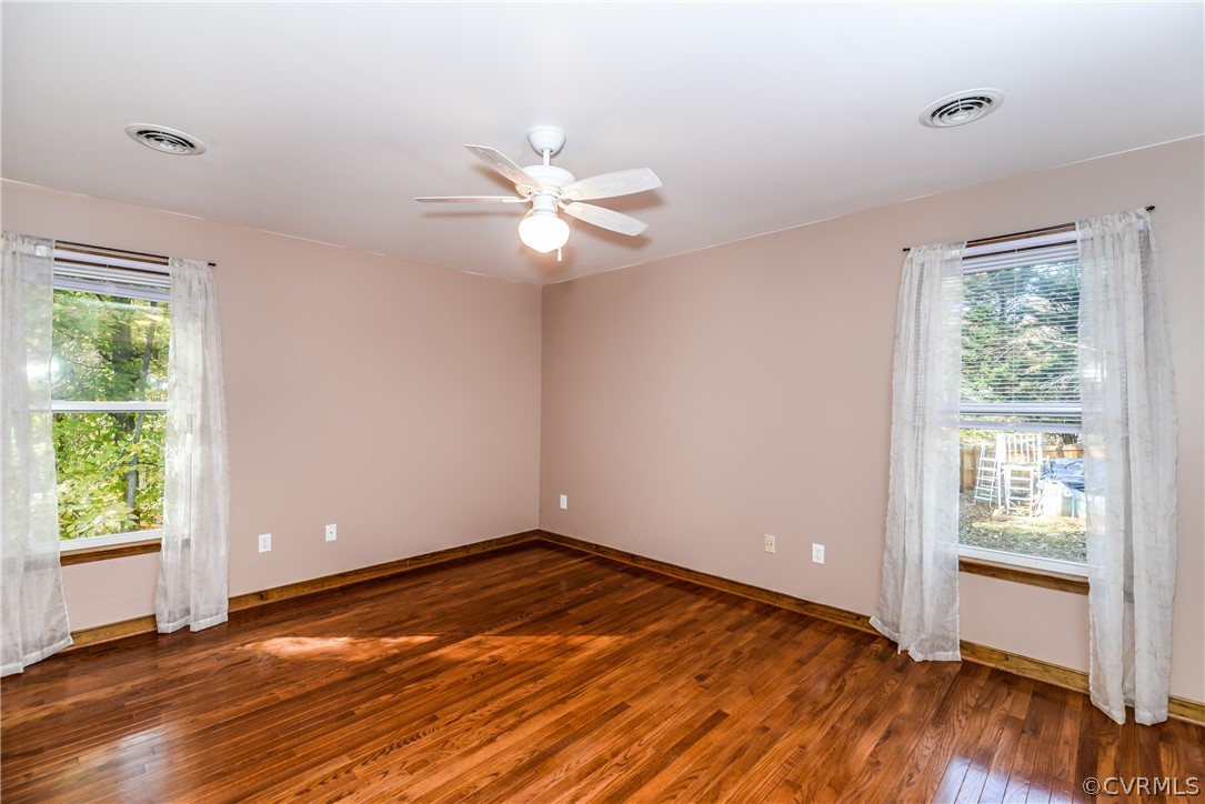 4217 Broad St Road Gum Spring, VA 23065 - Photo 23 of 39 wooden floor in an empty room with a window