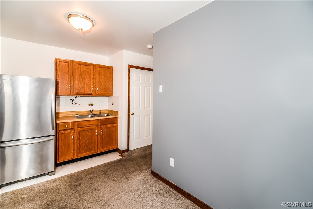4217 Broad St Road Gum Spring, VA 23065 - Photo 27 of 39 a kitchen with a refrigerator and cabinets