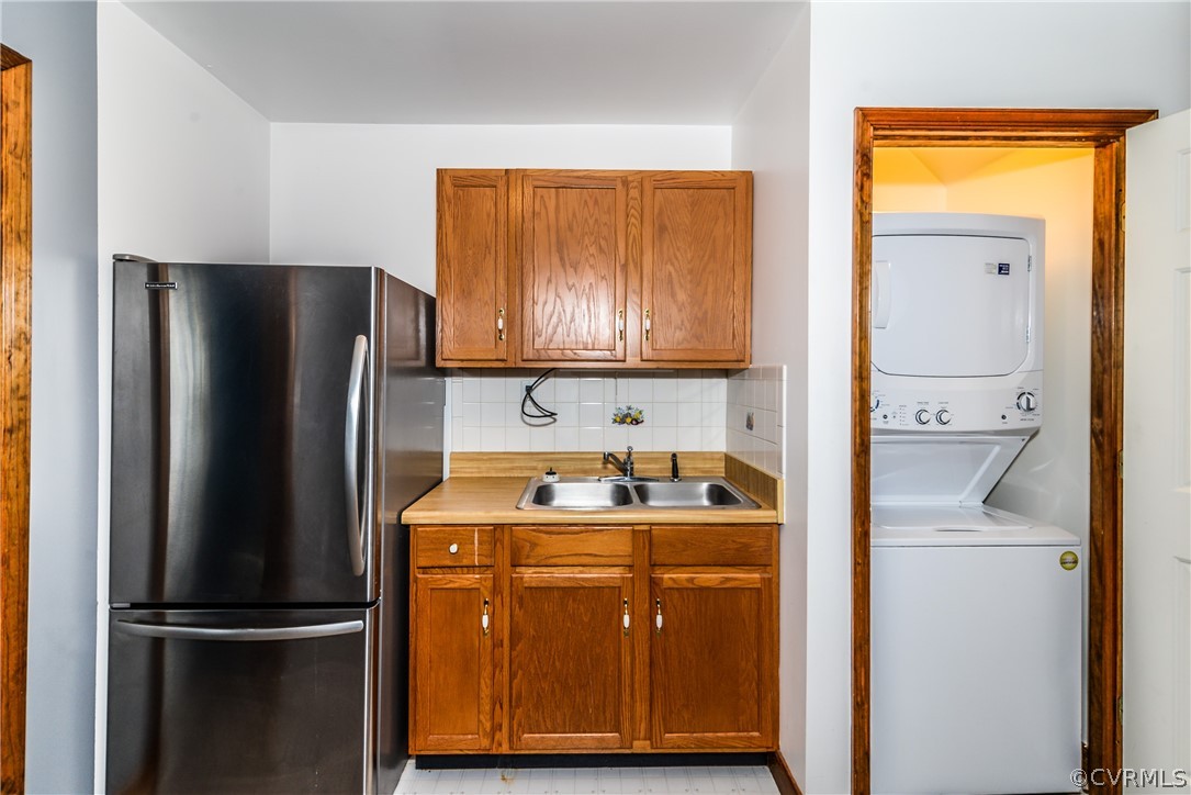 4217 Broad St Road Gum Spring, VA 23065 - Photo 29 of 39 a kitchen with a refrigerator sink and cabinets