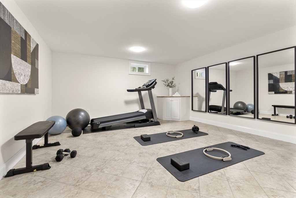 22 Scotney Road Newton, MA 02467 - Photo 33 of 42 a room with gym equipment and view of living room