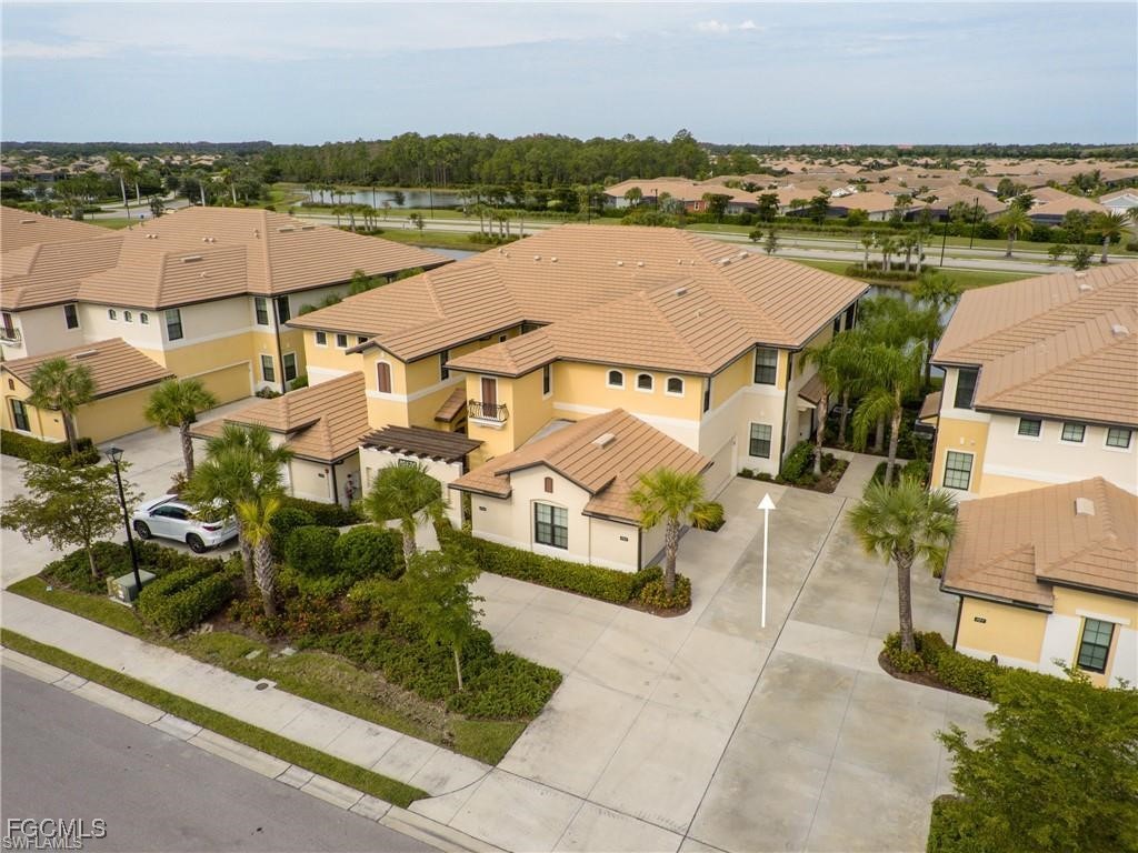 an aerial view of houses with outdoor space