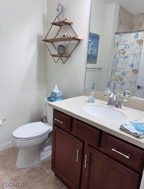 10470 Casella Way, Unit 102 Fort Myers, FL 33913 - Photo 11 of 18 a bathroom with a sink a toilet and mirror