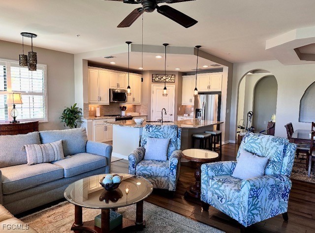 10470 Casella Way, Unit 102 Fort Myers, FL 33913 - Photo 3 of 18 a living room with furniture ceiling fan and a large window