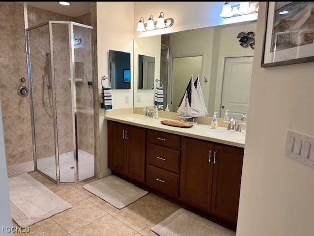10470 Casella Way, Unit 102 Fort Myers, FL 33913 - Photo 8 of 18 a bathroom with a double vanity sink mirror and double