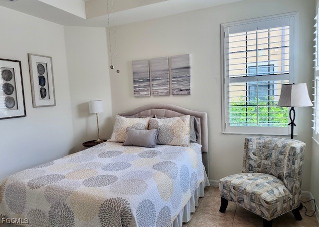 10470 Casella Way, Unit 102 Fort Myers, FL 33913 - Photo 10 of 18 a bedroom with a bed and a window